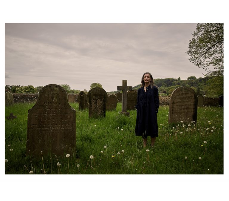 Joanne Burn photographed in the grounds of Eyam Parish Church